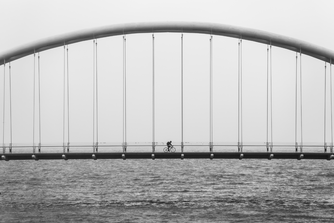 Arc Bridge having suspension in calculated distance